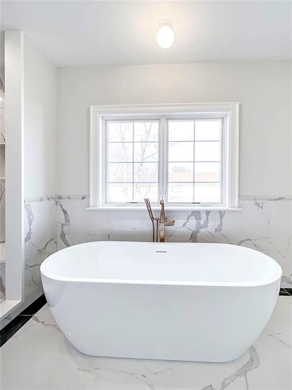 859 Lamont Ave, Staten Island, NY 10309 - full bathroom with marble finish floors, a freestanding tub, wainscoting, and tile walls