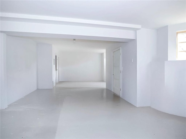 empty room with finished concrete flooring