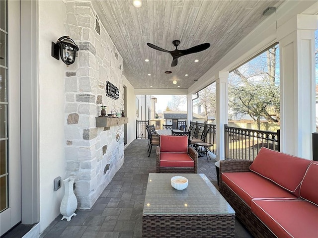 view of patio featuring outdoor dining space, an outdoor hangout area, and ceiling fan