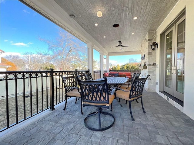 view of patio / terrace featuring outdoor dining space, french doors, and ceiling fan