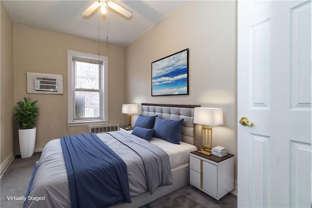 bedroom featuring a ceiling fan, a baseboard radiator, carpet floors, and a wall mounted AC