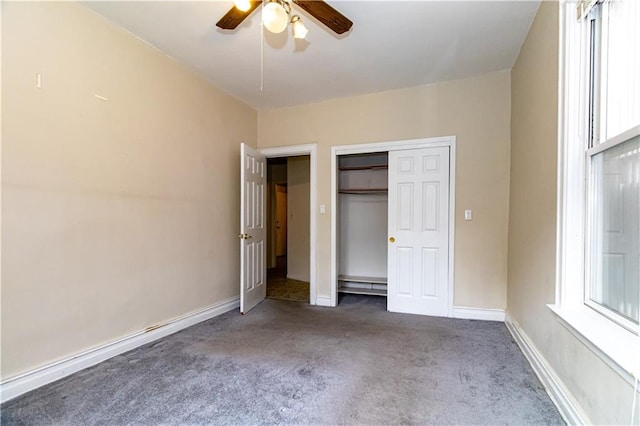 unfurnished bedroom with a closet, ceiling fan, baseboards, and carpet