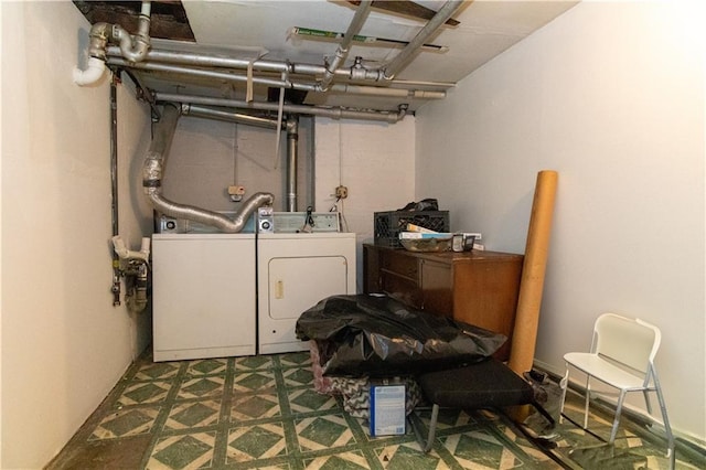 basement featuring tile patterned floors and washing machine and dryer