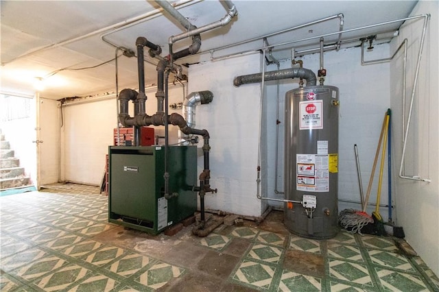 utility room featuring water heater and a heating unit