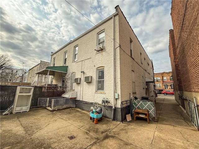 view of property with a wall mounted AC