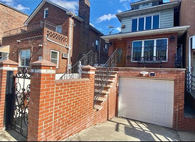 view of front facade with brick siding and an attached garage