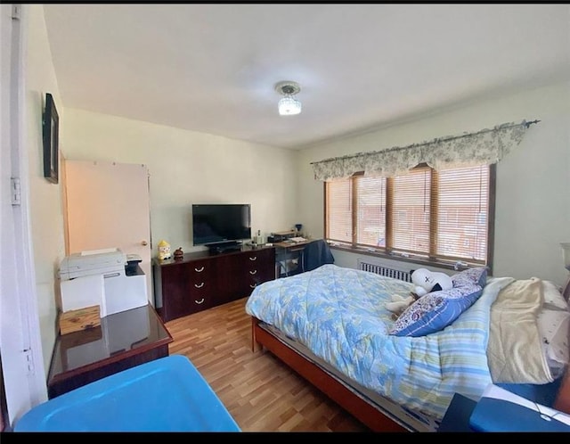 bedroom featuring wood finished floors