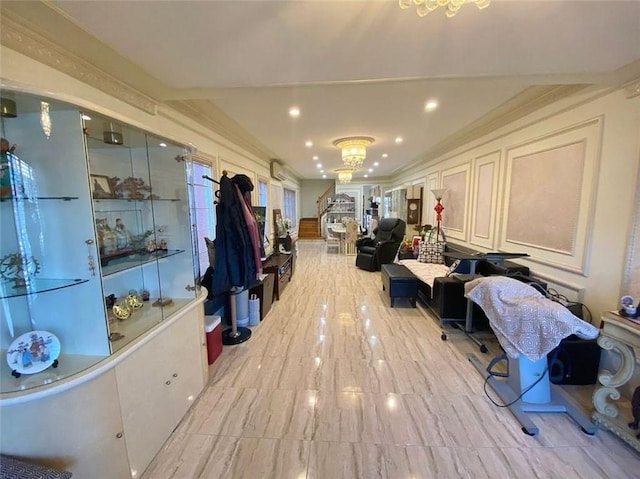 interior space with a notable chandelier, recessed lighting, and crown molding