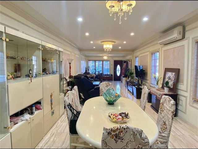 dining area featuring a wealth of natural light, an AC wall unit, a chandelier, and ornamental molding