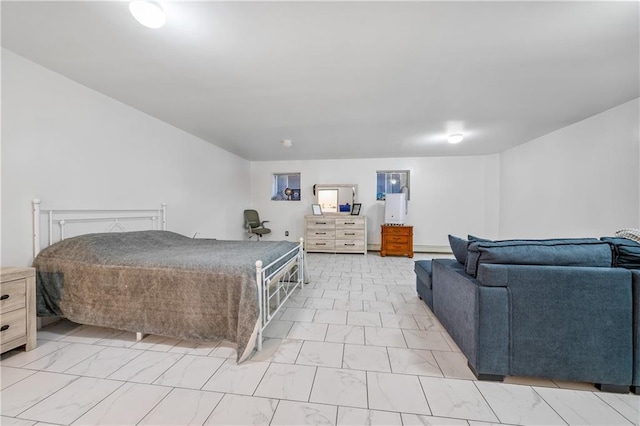 bedroom featuring marble finish floor