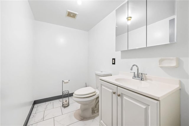 bathroom featuring visible vents, toilet, marble finish floor, baseboards, and vanity