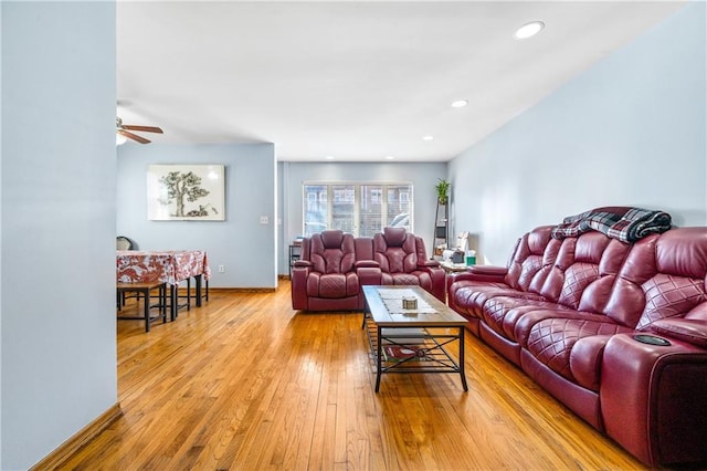 living room featuring recessed lighting, hardwood / wood-style floors, and a ceiling fan