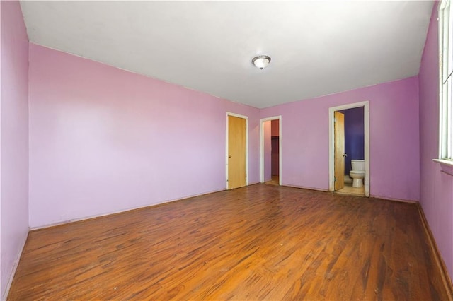 unfurnished room featuring wood finished floors