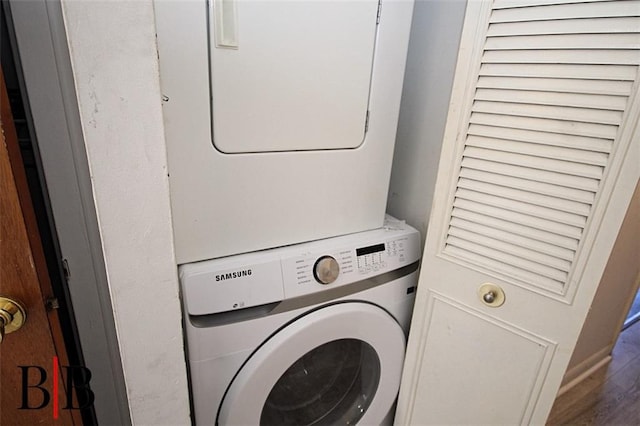 1121 E 73rd St Unit 69, Brooklyn, NY 11234 - laundry room featuring stacked washer and clothes dryer and wood finished floors