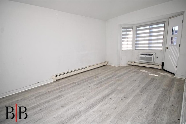 1121 E 73rd St Unit 69, Brooklyn, NY 11234 - empty room with baseboard heating, wood finished floors, and a wall mounted AC