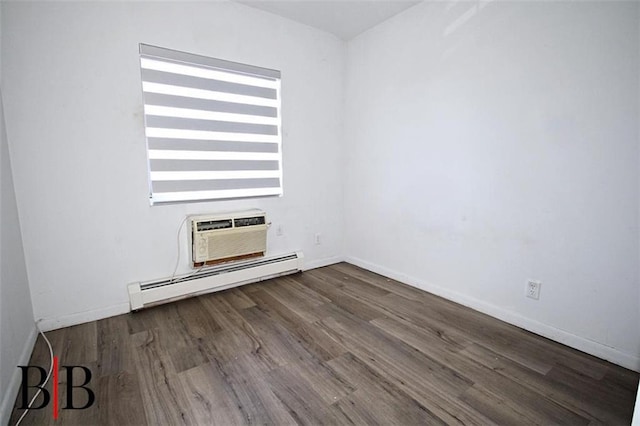 1121 E 73rd St Unit 69, Brooklyn, NY 11234 - unfurnished living room with a baseboard radiator, a wall mounted air conditioner, and wood finished floors