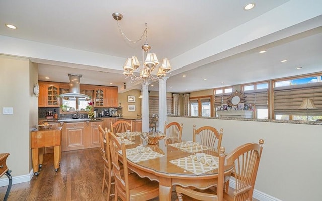 dining room featuring recessed lighting, baseboards, a notable chandelier, and dark wood-style floors