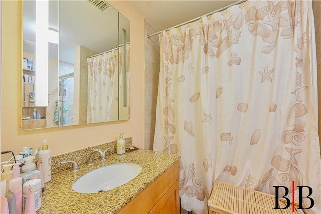 full bathroom with visible vents and vanity