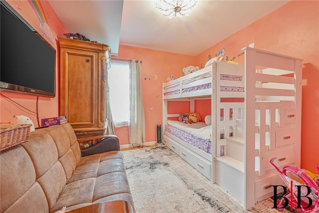 bedroom featuring baseboards