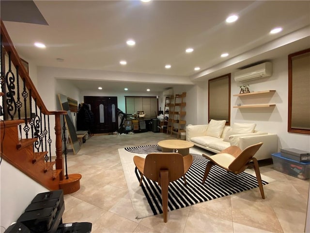 living room featuring a wall mounted air conditioner, stairway, and recessed lighting