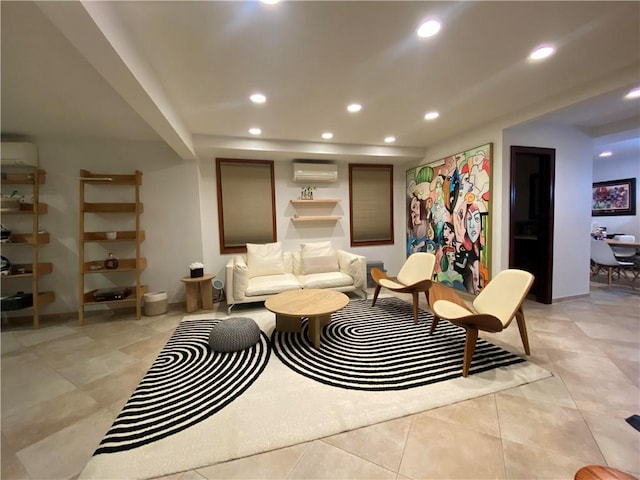 living room with an AC wall unit, light tile patterned floors, recessed lighting, and baseboards