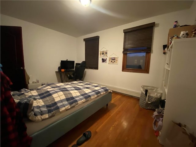 bedroom featuring wood finished floors