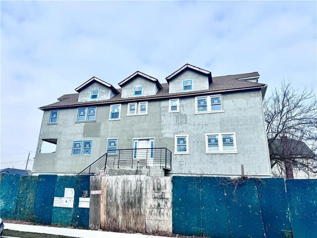 view of front of house with fence