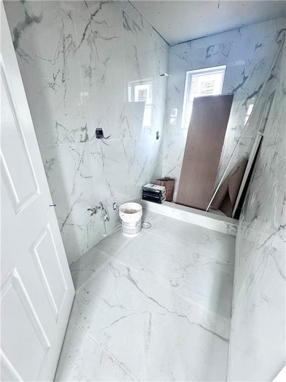 bathroom featuring marble finish floor