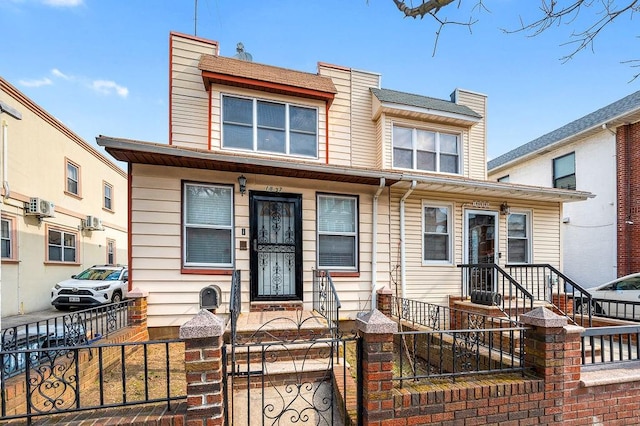 multi unit property featuring a fenced front yard