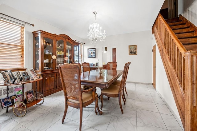 dining room with stairs, baseboards, a wealth of natural light, and a chandelier