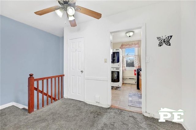 1722 E 55th St Unit 35F, Brooklyn, NY 11234 - corridor featuring estacked washer and dryer, an upstairs landing, a baseboard heating unit, carpet flooring, and baseboards