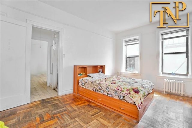 bedroom with radiator heating unit