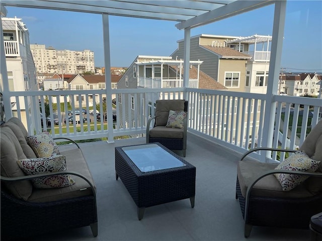 balcony featuring a pergola