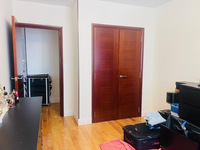 office featuring baseboards and light wood-style floors