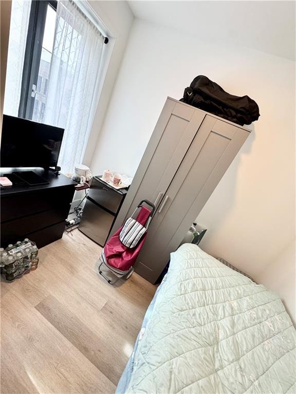 bedroom with wood finished floors