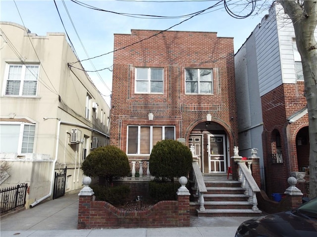 townhome / multi-family property featuring brick siding