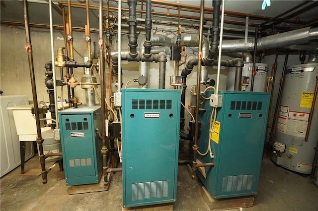 utility room with gas water heater, strapped water heater, and a heating unit