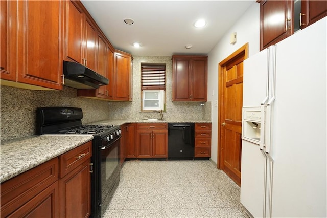 kitchen featuring black appliances, under cabinet range hood, backsplash, recessed lighting, and light stone countertops