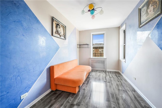 sitting room featuring wood finished floors and baseboards