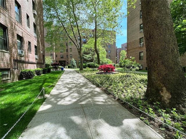 view of home's community with a yard