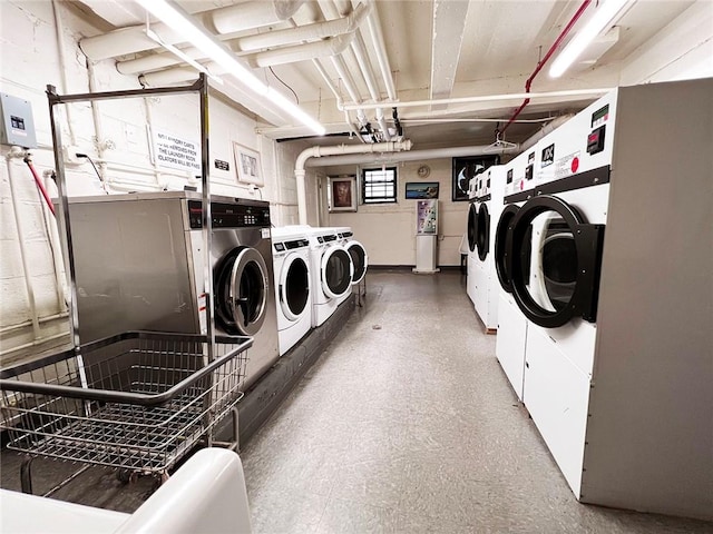 shared laundry area with washer and clothes dryer