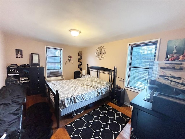 bedroom with wood finished floors