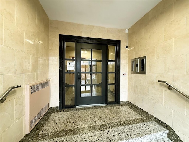 entrance to property featuring radiator