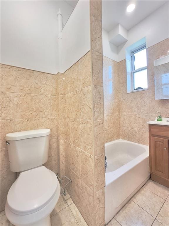 1708 Linden St, Ridgewood, NY 11385 - bathroom with tile walls, vanity, and tile patterned flooring