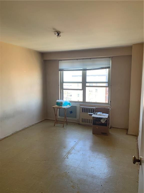 2652 Cropsey Ave Unit 15K, Brooklyn, NY 11214 - spare room featuring radiator heating unit