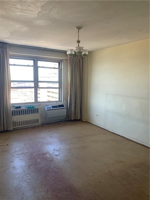 2652 Cropsey Ave Unit 15K, Brooklyn, NY 11214 - empty room with a chandelier, concrete flooring, and a wall mounted AC