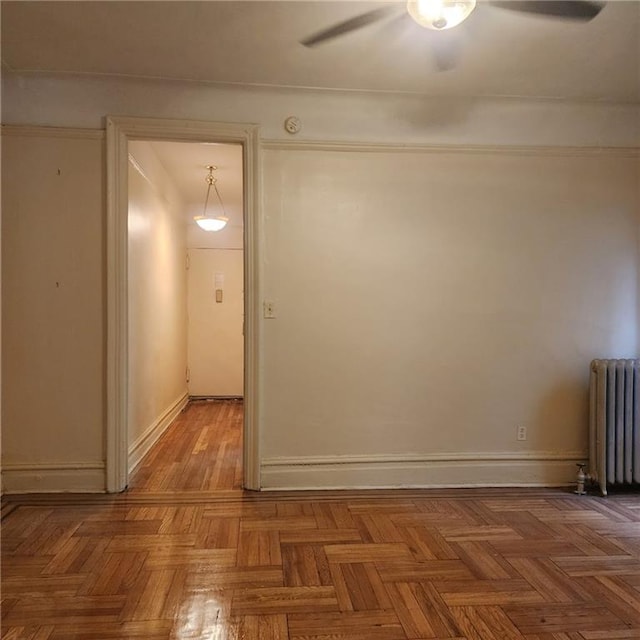 590 Parkside Ave Unit 2Be, Brooklyn, NY 11226 - unfurnished room featuring radiator, ceiling fan, baseboards, and a smoke detector