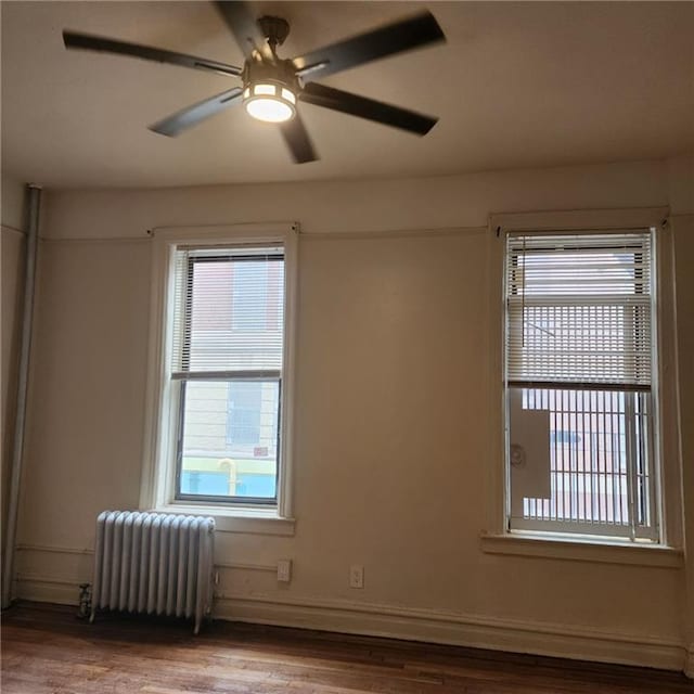 590 Parkside Ave Unit 2Be, Brooklyn, NY 11226 - unfurnished room featuring radiator, healthy amount of natural light, and wood finished floors