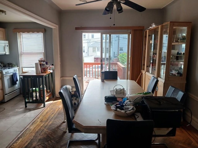 dining space featuring ceiling fan
