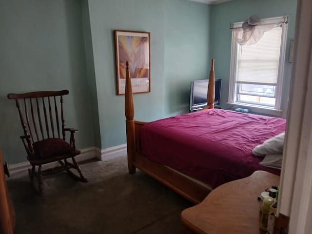 bedroom with carpet and baseboards